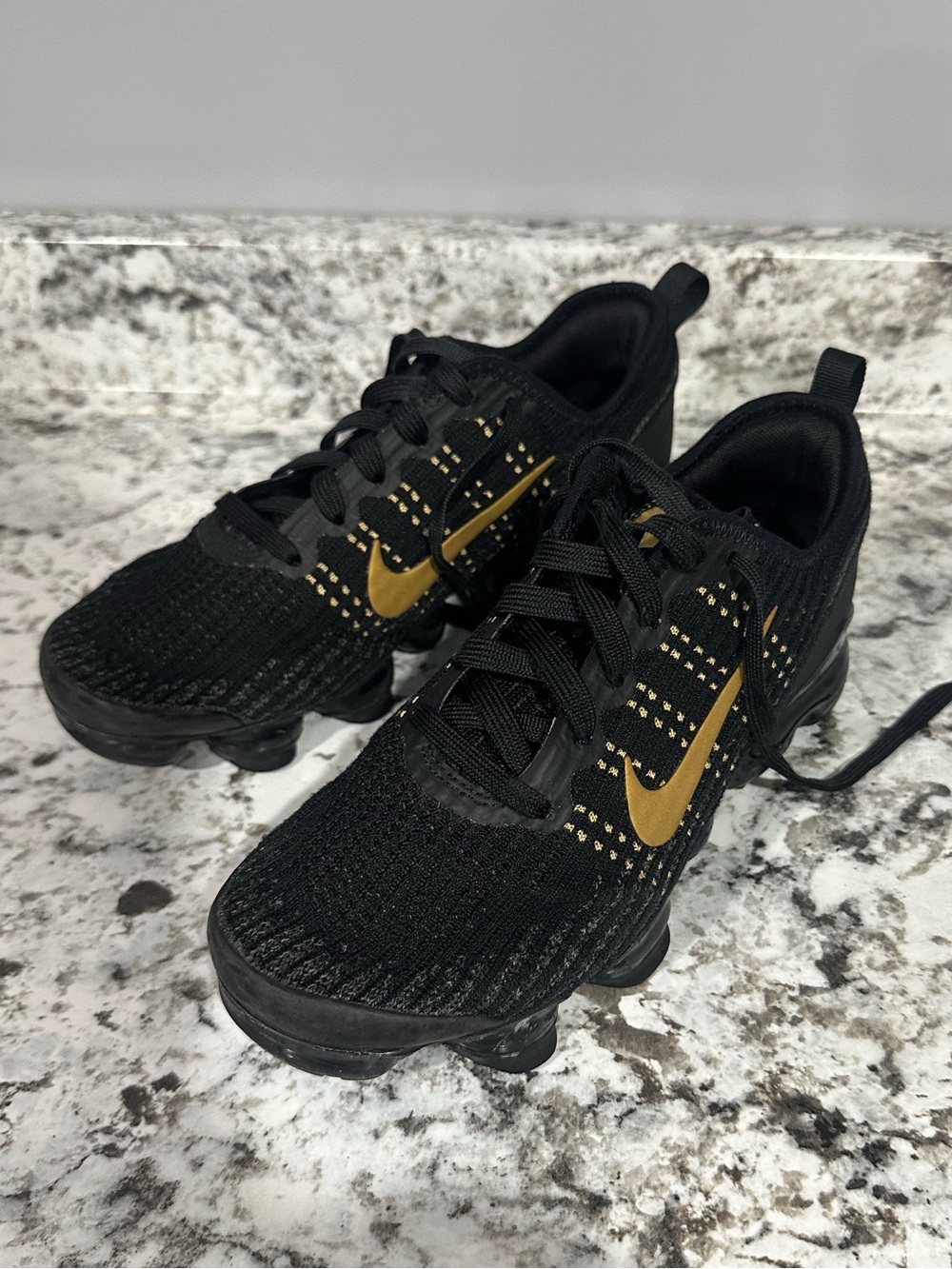 Nike Kids Black and Gold Swoosh Knit Sneakers